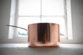 Copper pot on the window frame Royalty Free Stock Photo