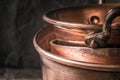 Copper pots and pans on the blurred background Royalty Free Stock Photo