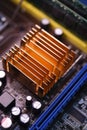 A copper radiator for cooling the chip on the computer board. Radio components.The computer's motherboard Royalty Free Stock Photo