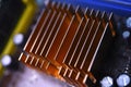 A copper radiator for cooling the chip on the computer board. Radio components.The computer's motherboard Royalty Free Stock Photo