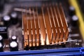 A copper radiator for cooling the chip on the computer board. Radio components.The computer's motherboard Royalty Free Stock Photo