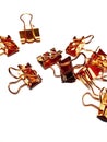 Copper rose gold paperclips or binderclips on white background Royalty Free Stock Photo