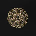 Copper round brooch with purple diamonds isolated on black