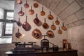 Copper saucepans on a wall