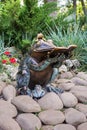 Copper sculpture of the reading frog