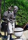 Copper sculpture of a water carrier