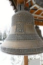 Copper snow-covered church bells orthodox church.