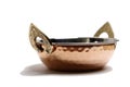 copper and stainless serving dishes (indian handi, karahi pots) white background (spoon, bowl handles) stacked