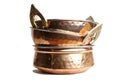 copper and stainless serving dishes (indian handi, karahi pots) white background (spoon, bowl handles) stacked