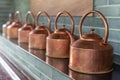 Copper teapots in a row Royalty Free Stock Photo