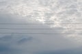 Copper telephone lines or power lines across sky with approaching thunderstorm clouds Royalty Free Stock Photo