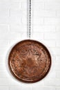 Copper tray hanged on wall