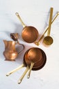 Copper utensils. Vintage copper cookware - cocottes, creamer and accessories for coffee Royalty Free Stock Photo