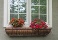 Copper window box of red and orange flowers Royalty Free Stock Photo