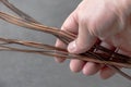 copper wire inside electrical wiring-an electrician has copper wire in his hand-lots of thick copper wire