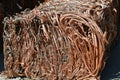Copper wire and tubes crushed into a cube at scrap metal recycling plant