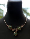 Copper wire wrapped necklace with celestial crystals and moss agate Royalty Free Stock Photo