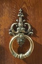 Coppery wrought door knocker Royalty Free Stock Photo
