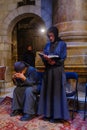 Coptic priests and pilgrims pray, Good Friday, Holy Sepulchre church