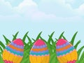 Colorful Easter eggs adorned with intricate patterns of pink, blue, orange, and green are nestled within vivid green grass. Royalty Free Stock Photo