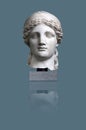 Copy of an antique Roman goddess Juno statue isolated on a blue background. Design element with clipping path