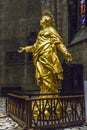 A copy of the gilded sculpture of La Madonnina in the apse of the Milan Cathedral