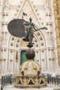 Copy of La Giralda - a statue of faith with a banner in his hands in Seville, Spain