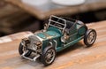 Copy of an old antique car on wooden table. Interior detail in a cafe Royalty Free Stock Photo