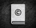 Copy right license book symbol stone wall background