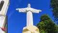 The copy of the sculpture of Christ the Savior spread his arms on blue sky background Royalty Free Stock Photo