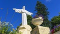 The copy of the sculpture of Christ the Savior spread his arms on blue sky background Royalty Free Stock Photo