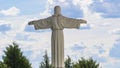 The copy of the sculpture of Christ the Savior spread his arms on blue sky background. Religion concept Royalty Free Stock Photo