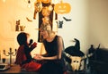 Beautiful young woman with a child with pumpkins autumn. Smiling mother and son. Boy in devil costume. Happy family is Royalty Free Stock Photo