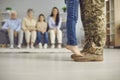 Copy space background with child& x27;s and veteran dad& x27;s feet on day of his returning home Royalty Free Stock Photo