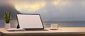 Copy space with blank screen portable tablet, coffee on wood table in golden hour at lake in the background Royalty Free Stock Photo
