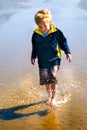 Young Boy Splashes in water vertical Royalty Free Stock Photo