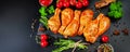 Background for a banner of meat with spices.Raw Marinated chicken meat leg swith spices for cooking for BBQ dark background. Top Royalty Free Stock Photo