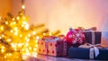 Copy space with gifts in selective focus on the background of Christmas tree bokeh lights Royalty Free Stock Photo