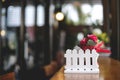 Copy space image artificial small red rose bouquet on wooden