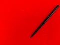 Copy space of Kajal pencil isolated on red