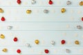 Copy space on light blue background. Christmas frame made of silver, gold and red balls and decorative snowflakes. Royalty Free Stock Photo