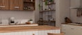 Copy space on minimal wood kitchen countertop in minimal Scandinavian kitchen Royalty Free Stock Photo