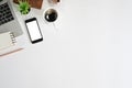 Copy space mockup smartphone, laptop, coffee, book and notepad on office desk, Top view table Royalty Free Stock Photo