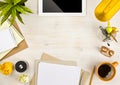 Copy space, paper, stationery and tablet computer on wooden background Royalty Free Stock Photo