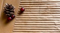 Pine cones and cranberries on the background of corrugated cardboard. Greeting card template with copy space Royalty Free Stock Photo