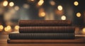 Antique leather books on a wooden table in a university or library with Empty light blur golden bokeh.