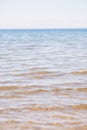 Copy space at the sea with a clear blue sky background above the horizon. Calm ocean waters at an empty beach. Peaceful Royalty Free Stock Photo