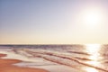 Copy space, seascape and landscape of a golden sunset and sky on the coast of Jutland in Loekken, Denmark. Sun setting