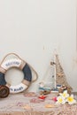 Copy space of set of a lifebuoy, boat, starfish and flowers. Vacation on the sea. Royalty Free Stock Photo