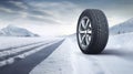 copy space, stockphoto, Brand new winter car tires showcased against a snowy road backdrop. Wintertire in a winte landscape